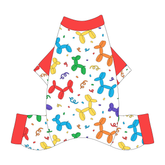 Comfy Pajamas with solid red sleeves and a dog friendly pattern that shows party images like balloons and confetti. It's complete with Pawty Animal trim on the sleeves and solid red trim on the neck and legs.